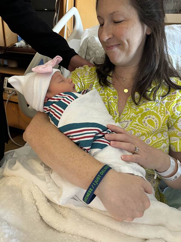 new mom with postpartum bracelet